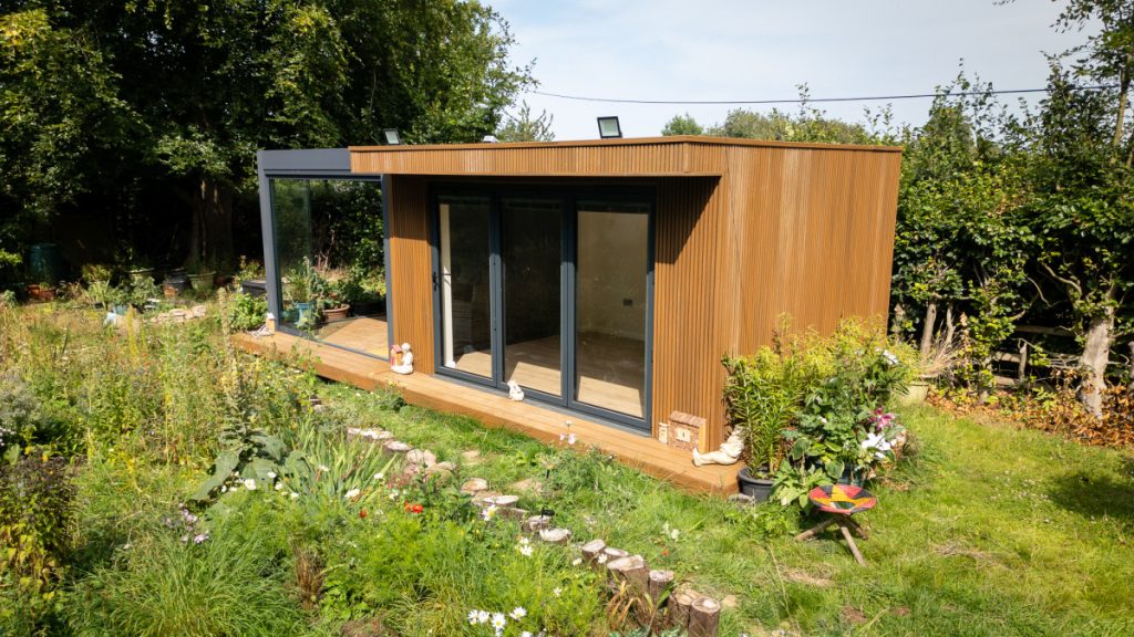 Garden room positioned beside landscaped wild garden